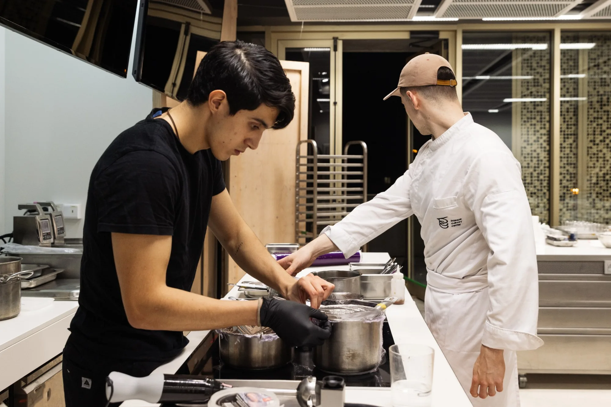 Two cooks at the pass, Basque Culinary Center.