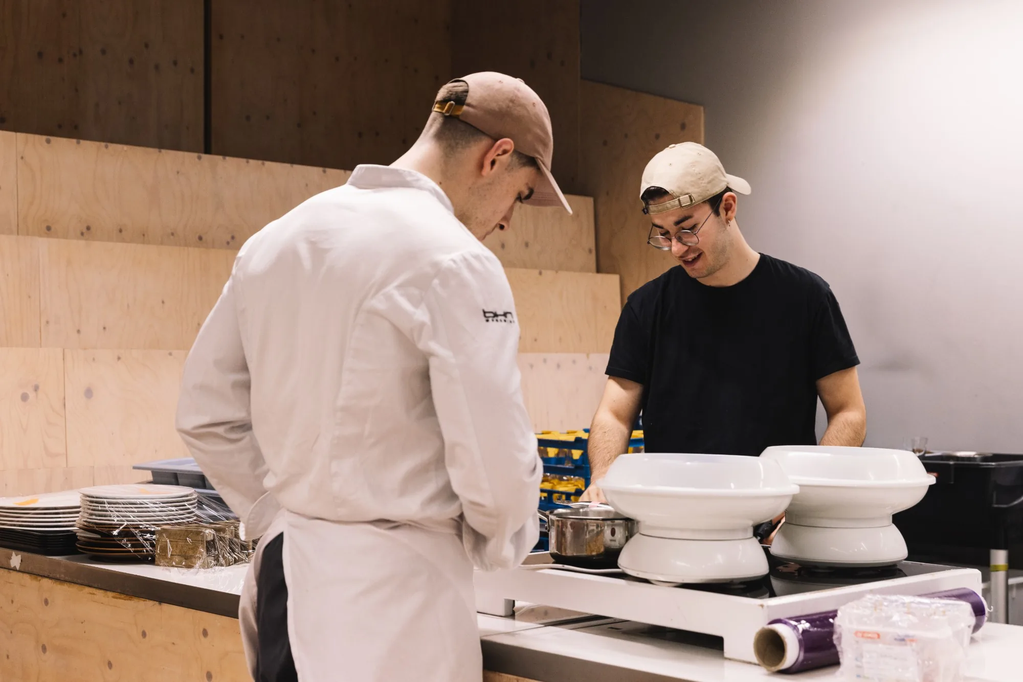 Two cooks at the pass, Basque Culinary Center.